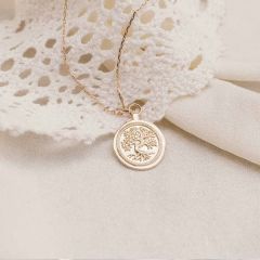 Taufmedaille mit reliefiertem Baum des Lebens